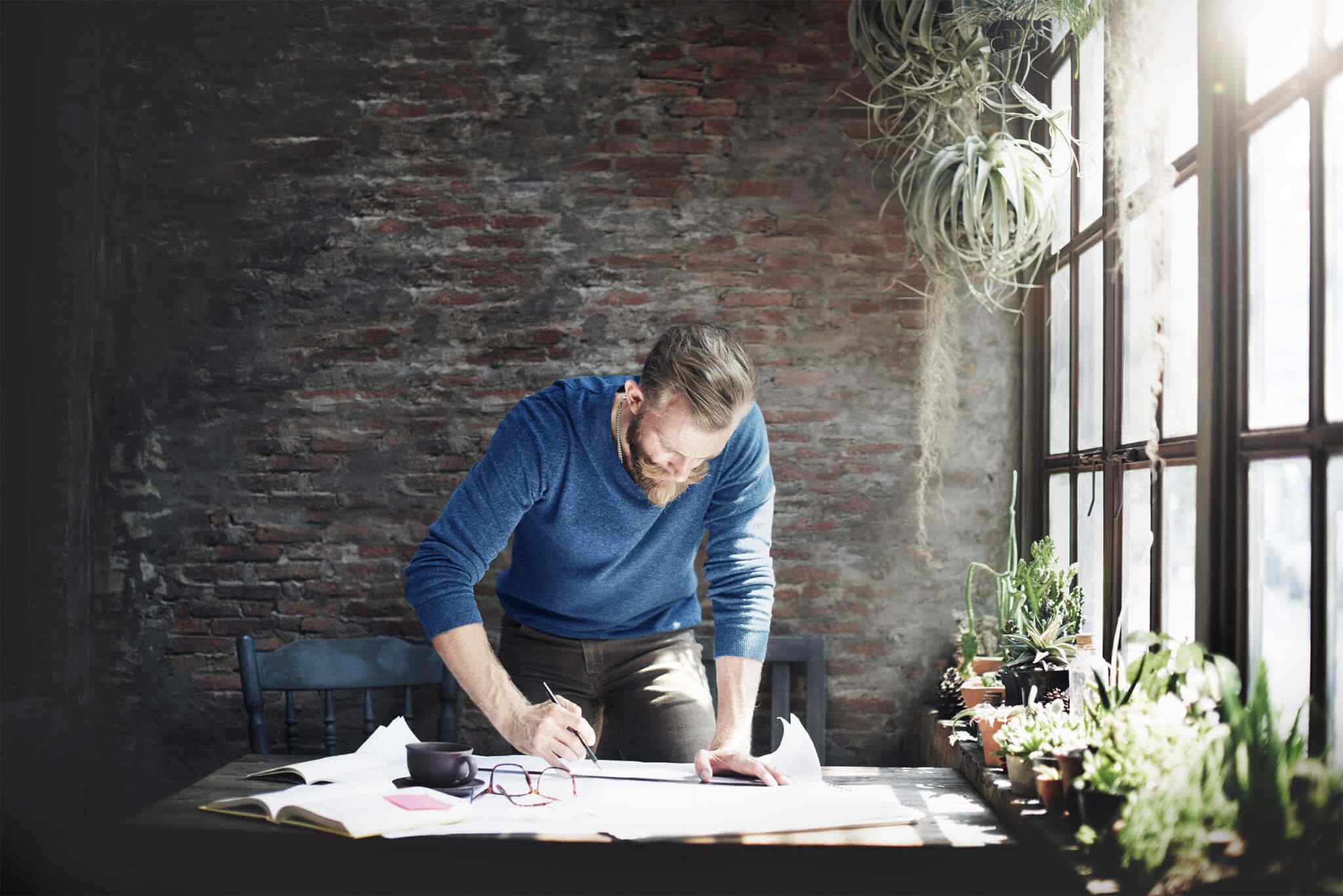 Designer reviewing plans in an interior studio